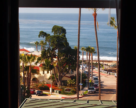 view of La Jolla beach from a window at the Grand Colonial Hotel