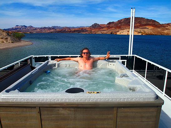 writer relaxing at a jacuzzi in a houseboat at Lake Mohave