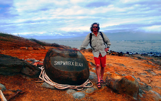 the writer at Shipwrech Beach with its volcani rock and red clay