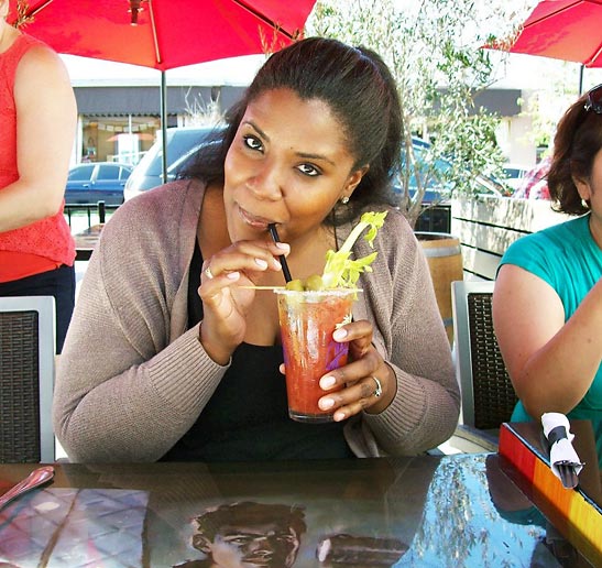 customer enjoying a drink at the Attic on Broadway, Long Beach