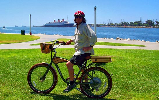 writer on a Pedego Electric Bike along Long Beach shoreline