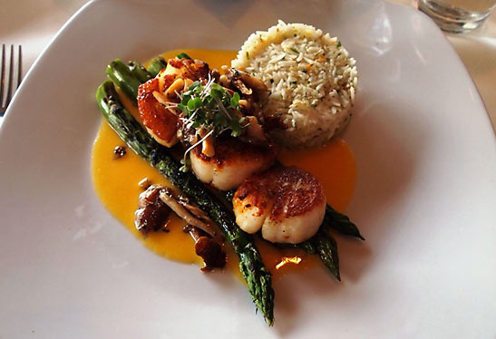 pan-seared scallops with citrus rice and asparagus at Windows on the Water restaurant