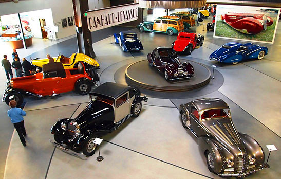 vintage cars on display including a 1936 Bugatti Type 57SC Atlantic on the spinning stage at the Mullin Automative Museum