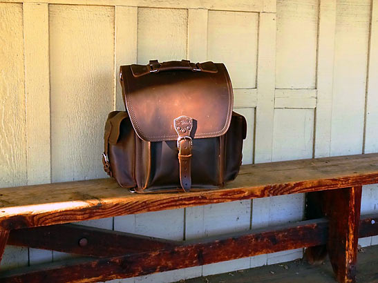Saddleback Leather's squared backpack on a bench