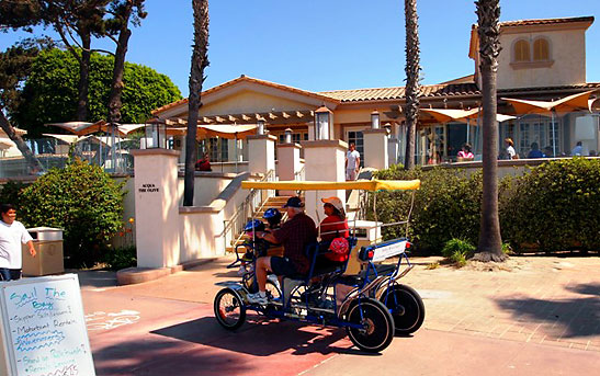 a couple on a cart at the Hilton San Diego