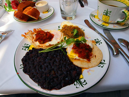 a plate of Juevos Rancheros, with eggs, corn tortillas, black beans and salsa, at The Ivy