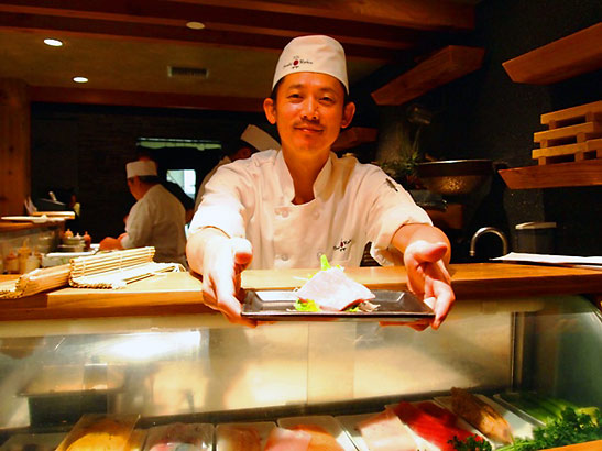 chef showing off his dish at the Sushi Roku on Ocean Blvd.