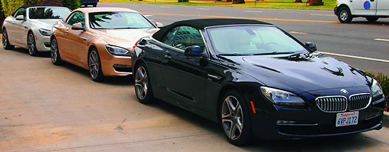 a brand new BMW 6 Series conveertible and other cars for hotel guests at the Fairmont Miramar Hotel