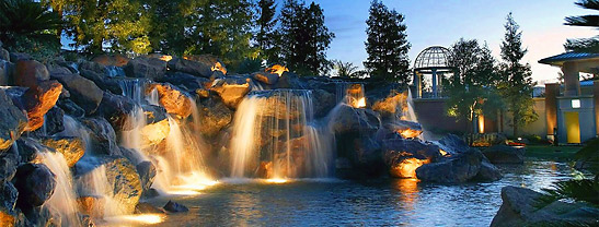 cascading waterfalls with an iron-domed gazebo in the right background, Four Seasons Hotel, Wesstlake Village