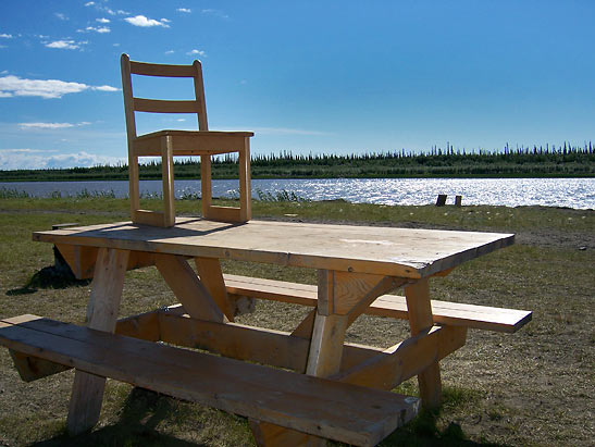 table and chair beside the McKenzid River