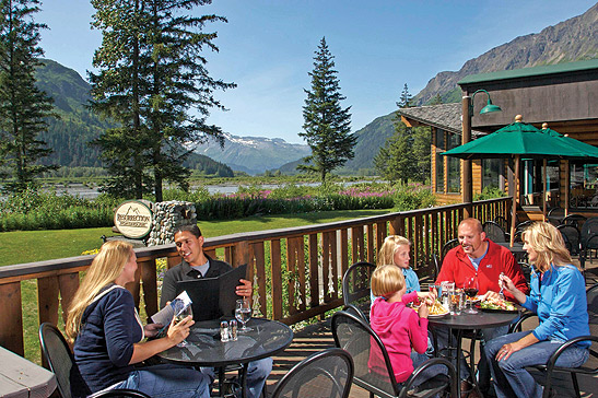 a couple and a family at the Seward Windsong Lodge