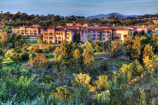 exterior view of the Grand Del Mar nestled in the rolling hills of Los Peñasquitos Canyon Preserve, San Diego County