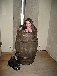 writer inside wooden barrel