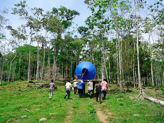 workers hauling 1,250 gallon tank up the mountain