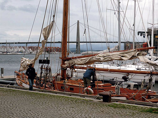 moored yachts in Stavanger with the Bybrua suspension bridge spanning the Stromsteinsundet in the background