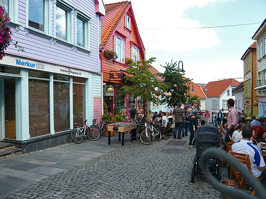 a narrow street lined by shops in central Stavanger