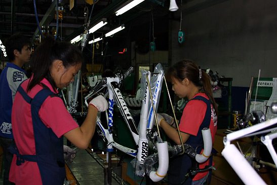 workers assembling a bicycle at a plant in Taiwan