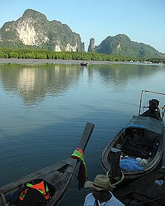 limestone karst formations, Krabi with boats in the foreground
