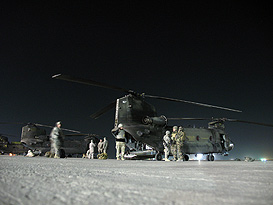 troops boarding helicopter on tarmac