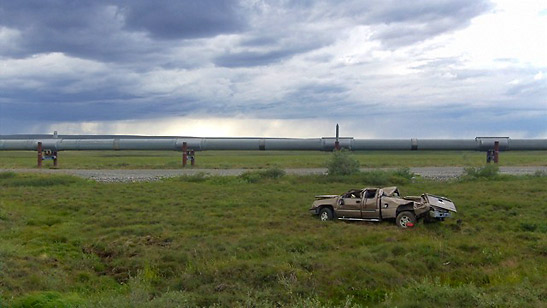 wrecked vehicle near the pipeline