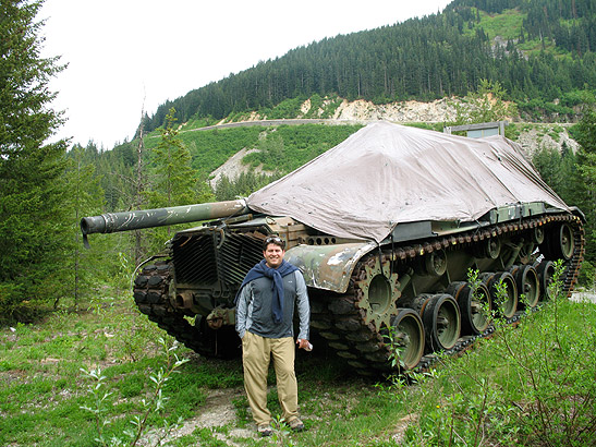 Alex posing in front of old tank
