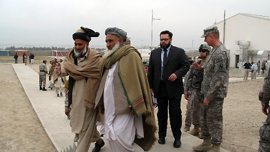 maliks, tribal leaders and US Army soldiers at a dedication of a new building, Jalalabad