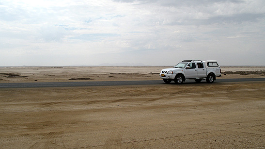 the writer's rented car on a desert road, Namibia