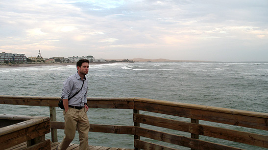 a view of Namibia's South Atlantic coast with the writer's friend in the foreground