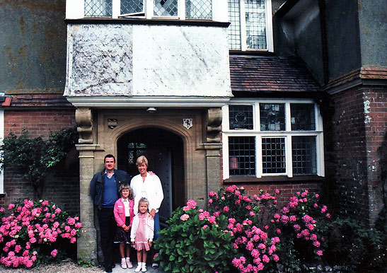 photo of writer with his family at his grandparents' home in Tenantrees, England