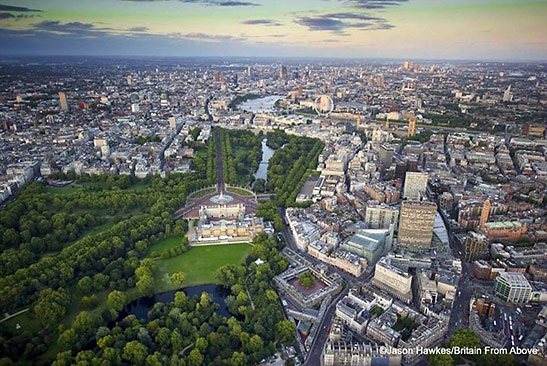 aerial photo of Buckingham Palace with the skyline of London 