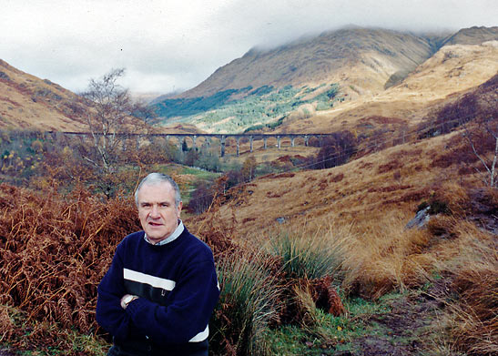 author at the Scottish highlands with the Glenfinnan Viaduct in the background
