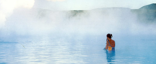 guest trying out the warm waters of the Blue Lagoon Geothermal Spa