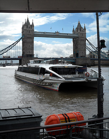 boat on the Thames with the Tower Bridge in the background, London