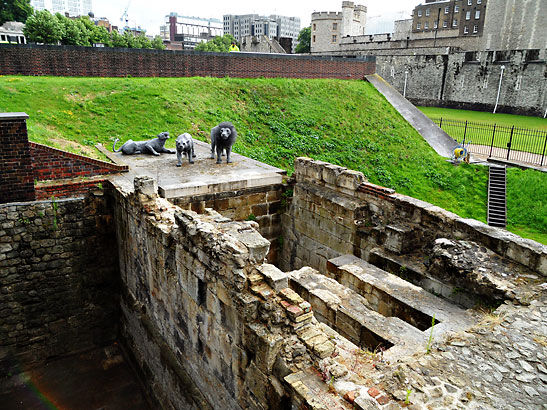 the left hand side of the Tower of London showing animal figures on a ledge