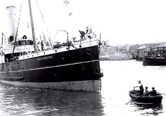 a ship of the British Merchant Navy in a harbor