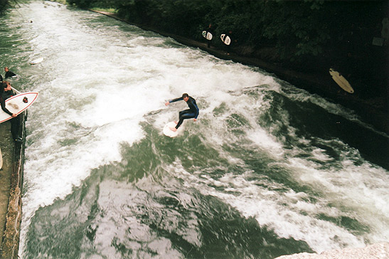 river surfing at the Eisbach surfing spot in the Prinzregentenrasse, Munich