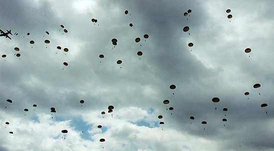 American airborne troops parachuting over St. Mere Eglise, Normandy, France to commemorate the 60th Anniversary of D-Day, June 6th, 2004