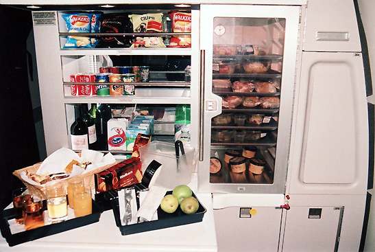 the kitchen at the business class section of a 747 British Airways flight