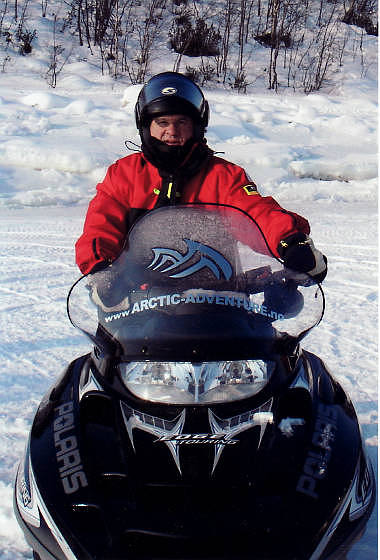 the writer in a snowmobile in Kirkenes, Norway