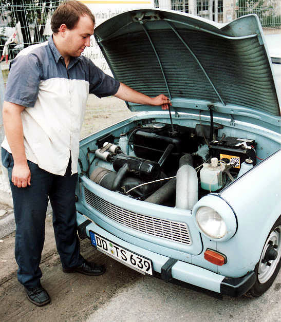 German with a Trabant car