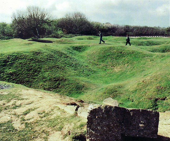 bomb craters litter the rolling hillsides at Pointe du Hoc