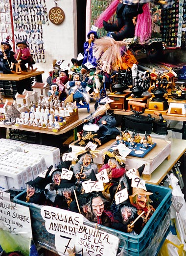 toy witches for sale at a stall in Santa Tegra