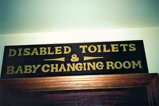 sign in a country railroad station in western England