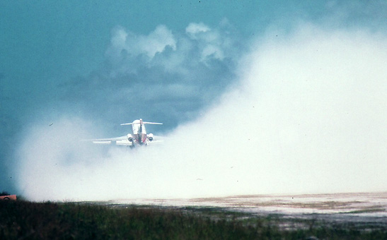 a Boeing 727 taking off from Truk generates white coral dust