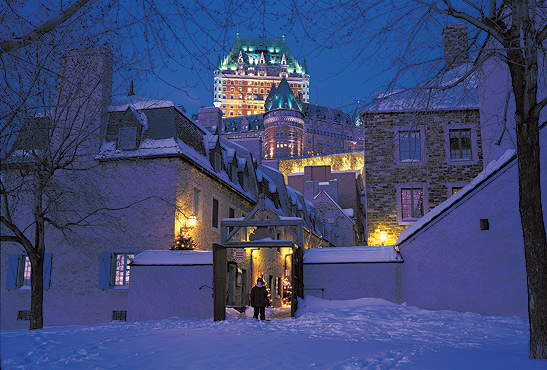 the exterior of the Fairmont Le Chteau Frontenac on a winter night