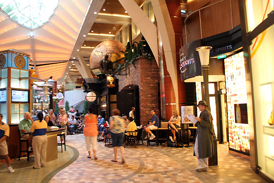 the writer/detective lounging near the cafes at the Royal Promenade of the Oasis of the Seas