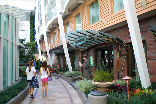 shops with gardens line the pathway of the Central Park