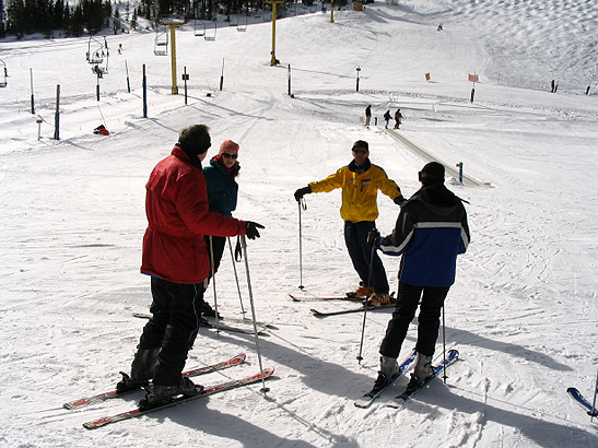 ski instructor with beginning skiers