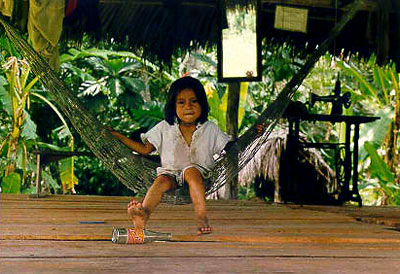 Little girl on hammock at the entrance to the Loving Light Lodge