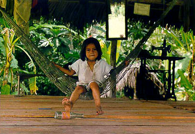 Little girl on hammock at the entrance to the Loving Light Lodge
